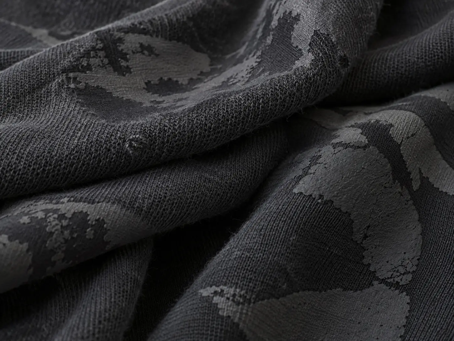 Fabric panels with different unbranded print finishes arranged for comparison