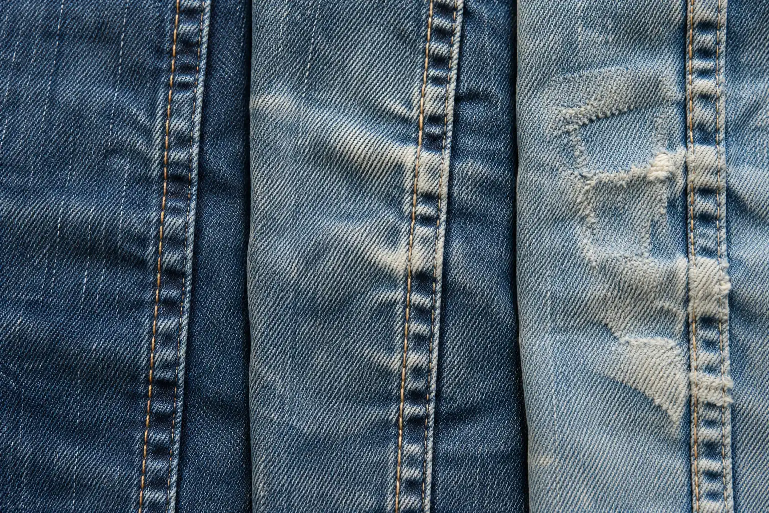 Denim panels showing different seam shading and abrasion patterns under neutral light